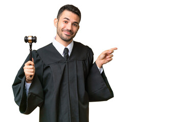 Judge caucasian man over isolated background pointing finger to the side