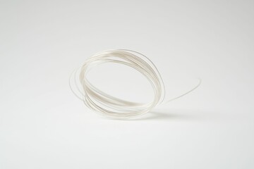 Fototapeta premium Silver wire coils on white background.