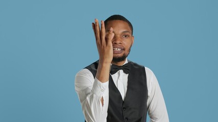 Lounge area employee explaining luxury amenities to guests at the five star resort, assisting clients upon their arrival. Hotel concierge staff recommending leisure activity to relax. Camera A.