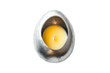 unique. silver-colored candle holder shaped like an egg. containing a yellow candle the design is modern and minimalist. emphasizing simplicity and elegance the candle is unlit. suggesting a calming a