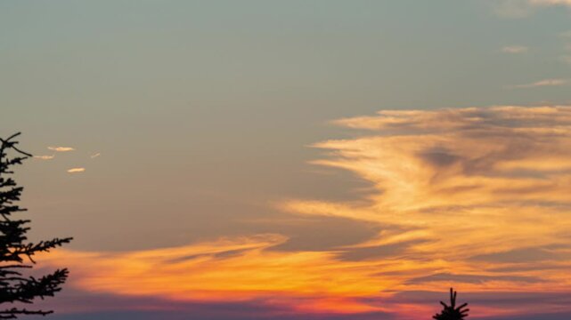 Aerial view footage B roll nature landscape background. round red sun rise up from horizontal at a peaceful sea in summer season. orange color sunset, sunrise sky reflect on water rapping gently.