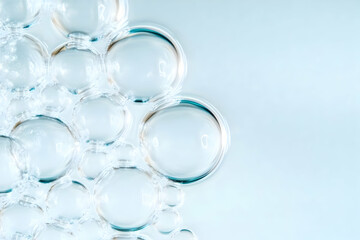 Transparent Bubbles Cluster Together on a Soft Blue Background