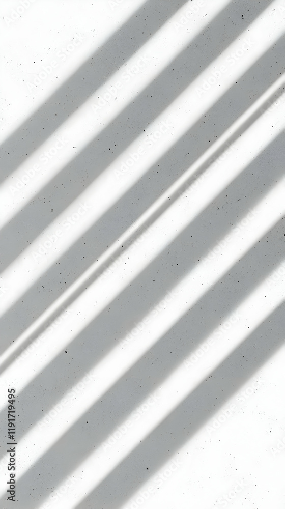Poster diagonal shadows cast on a textured white surface creates an abstract pattern.