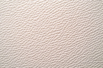 Close-up of Light Beige Leather Texture Shows Detailed Grain and Soft, Supple Surface