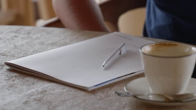 A Creative Workspace Complete with Coffee and a Notebook for Inspiration and Comfort