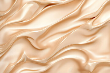 Fototapeta premium Flowing Beige Satin Fabric Drapes Elegantly, Creating a Smooth Textured Background