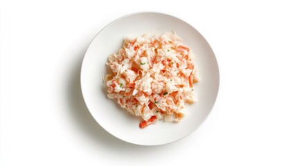 Crab salad served on a white plate, isolated on white background.