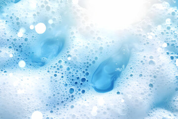 Light Blue Soap Foam Creates a Textured Background with Bubbles and Highlights.
