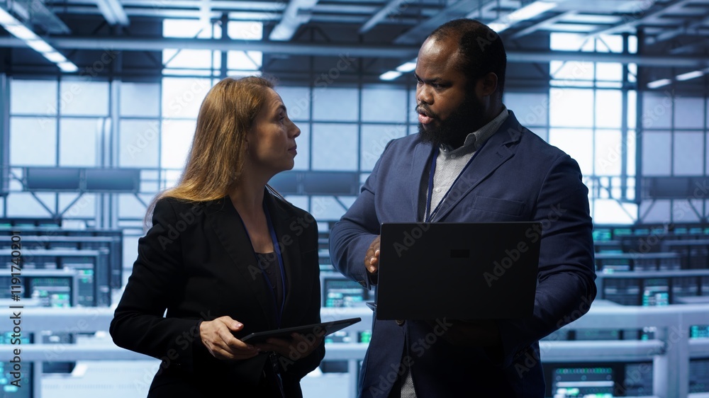 Poster african american admin greeting inspector arriving in data center to supervise operations. it expert