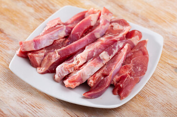 Image of fresh raw turkey fillet on wooden desk before cooking, nobody