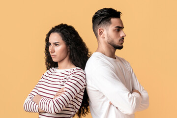 Relationship Crisis. Offended Arabic Couple Standing Back To Back Over Yellow Background, Young...