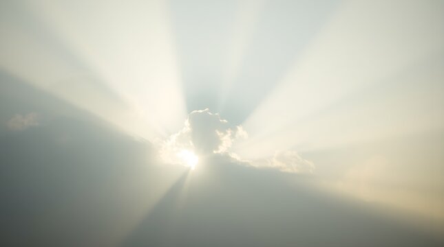 Low-angle shot, soft cinematic haze, sun rays piercing through clouds, hazy background, soft focus, dramatic lighting