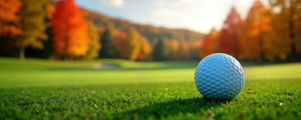 Golf ball sits on autumn golf course green. Picturesque landscape of colorful trees creates peaceful atmosphere. Relaxed, calm scene of fall sports. Autumn colors stunning. Serene sport image great