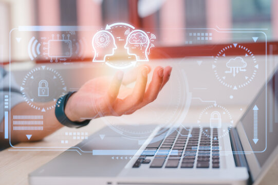 artificial intelligence AI technology and Digital transformation concept, businessman using computer laptop and holding virtual Ai icon