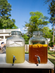Lemonade and Tea In Glass Jars With Serving Spouts