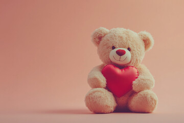 Teddy bear holding a red heart for Valentine's Day