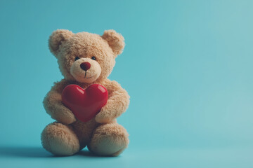 Obraz premium Cute teddy bear holding red heart Valentines Day isolated color background