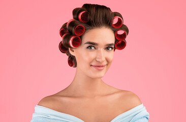Housewife's Portrait. Pretty Girl With Hair Curlers Smiling Looking At Camera Posing Over Yellow...