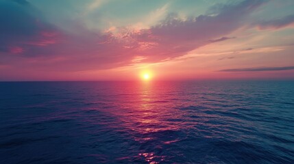 Obraz premium Serene sunset over the calm ocean, creating a picturesque view