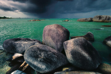 View of large stones by the sea
