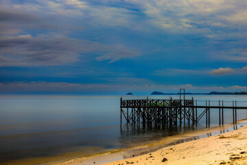 Wooden pier by the sandy beach