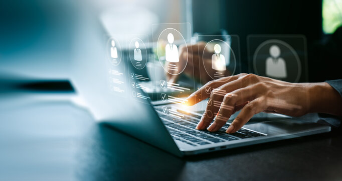 Digital Recruitment Process with Hand Typing on Laptop Keyboard, Interactive Profiles Displaying Candidate Data and Checklist Icons Representing Talent Selection and Employment Screening - Powered by Adobe