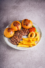 Delicious meal with beans bread fries and butter on a plate
