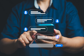 Close-up of hands texting on smartphone with holographic chat interface for social media and messaging.