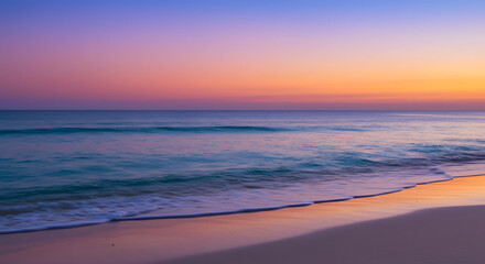 Obraz premium As the vibrant sunset unfolds, the indistinct tropical waves lovingly interact with the delicate sand.