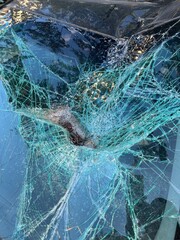 An Intricate Close Up View of Cracked Glass Featuring a Unique Spiderweb Pattern Design