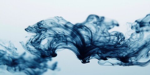 Contrast monochrome balance concept. Ethereal blue ink swirls gracefully across a light background, creating a serene and artistic visual effect.