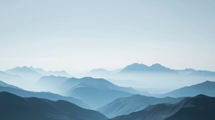 Serene Misty Mountainscape: A Breathtaking Panorama of Blue Hues