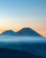 Fototapeta premium mountain at sunrise, Sindoro and Sumbing Mount