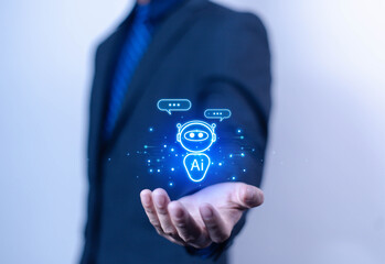 Businessman chatting with AI or artificial intelligence technology. A man uses a laptop computer to chat with an intelligent AI.