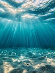 Naklejka premium Sunbeams pierce tranquil ocean depths illuminating sandy seabed. AI Generated
