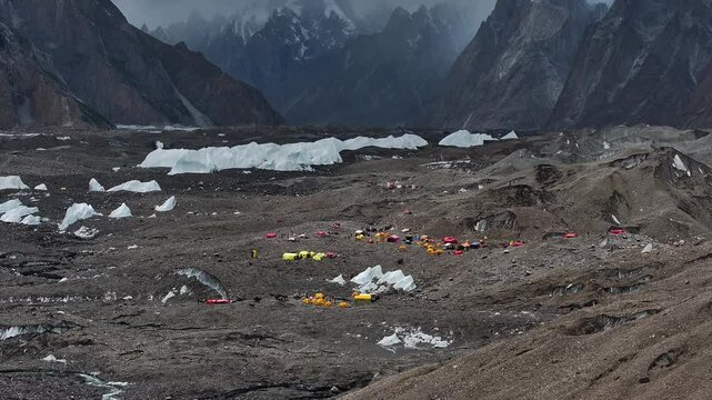 Aerial drone footage of tents and camp in the Karakoram Mountains of Pakistan, captured while trekking to K2 Base Camp.