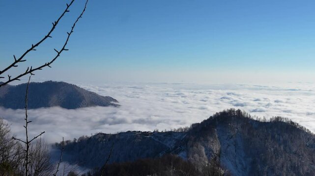 Amazing cloud formations over Gebele city at suset, surrounded by the Caucasus Mountains in early winter evening. Azerbaijan