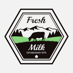 A colorful badge style logo for fresh milk company