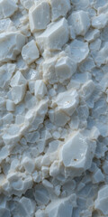 Close-up of fragmented white material resembling crushed ice or mineral.