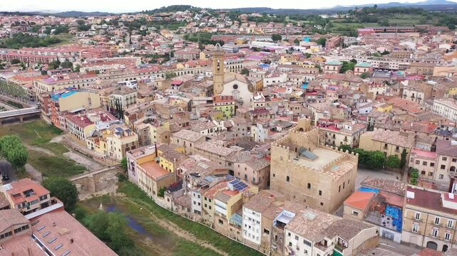 Summer view from drone of center of medieval Spanish town of La Bisbal d Emporda with episcopal palace castle and Church of Santa Maria, province of Girona, Catalonia
