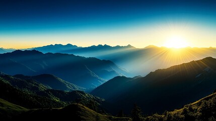 Breathtaking sunrise over mountain peaks, casting golden light on the valley below.