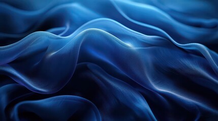Fototapeta premium A close-up of flowing blue fabric, showcasing smooth curves and light reflections.