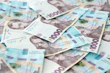 Big amount of ukrainian new one hundred hryvnia money bills with modern design. Financial concept, business