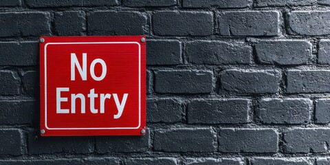 Fototapeta premium No Entry sign on a blackened brick wall background. Prohibition sign in unique setting.