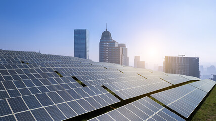Urban Solar Panel Installation with Modern Skyline at Sunrise