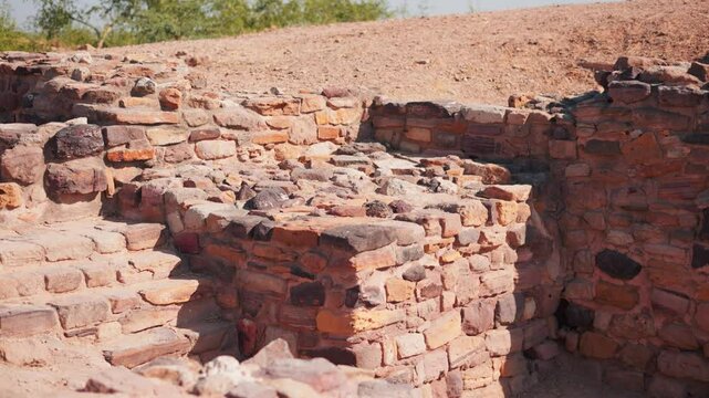 4K shot of ancient civilization ruins of Harappan city in Dholavira, Kutch, India. The ancient city of Dholavira UNESCO World Heritage Centre. Archaeological site of Indus valley civilization.