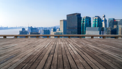 Panoramic Urban Skyline View with Wooden Deck Overlooking Cityscape