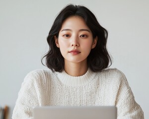 Young Korean Woman Focused on Entrepreneurship and Innovation in Modern Co-working Space, Emphasizing Entrepreneurship and Financial Assistance