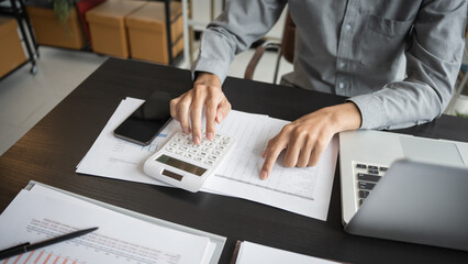 Business man accountant financial analyst and auditor working and laptop for calculating 