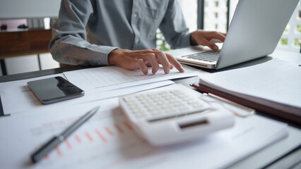 Business man accountant financial analyst and auditor working and laptop for calculating 